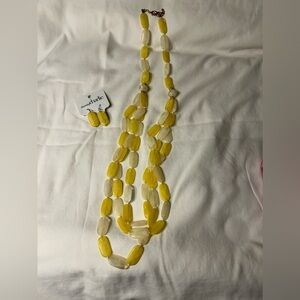 Yellow and ivory colored flat oval beads with Matching earrings included.